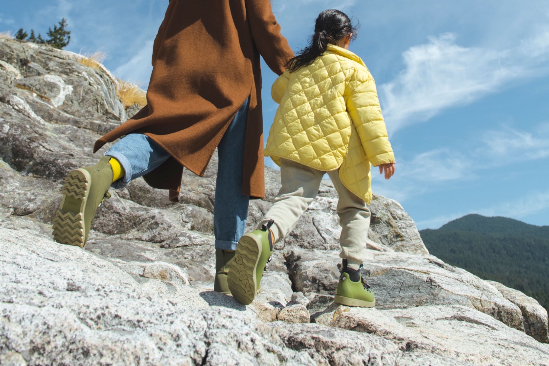 ADULT AND CHILD HIKING IN BOOTS