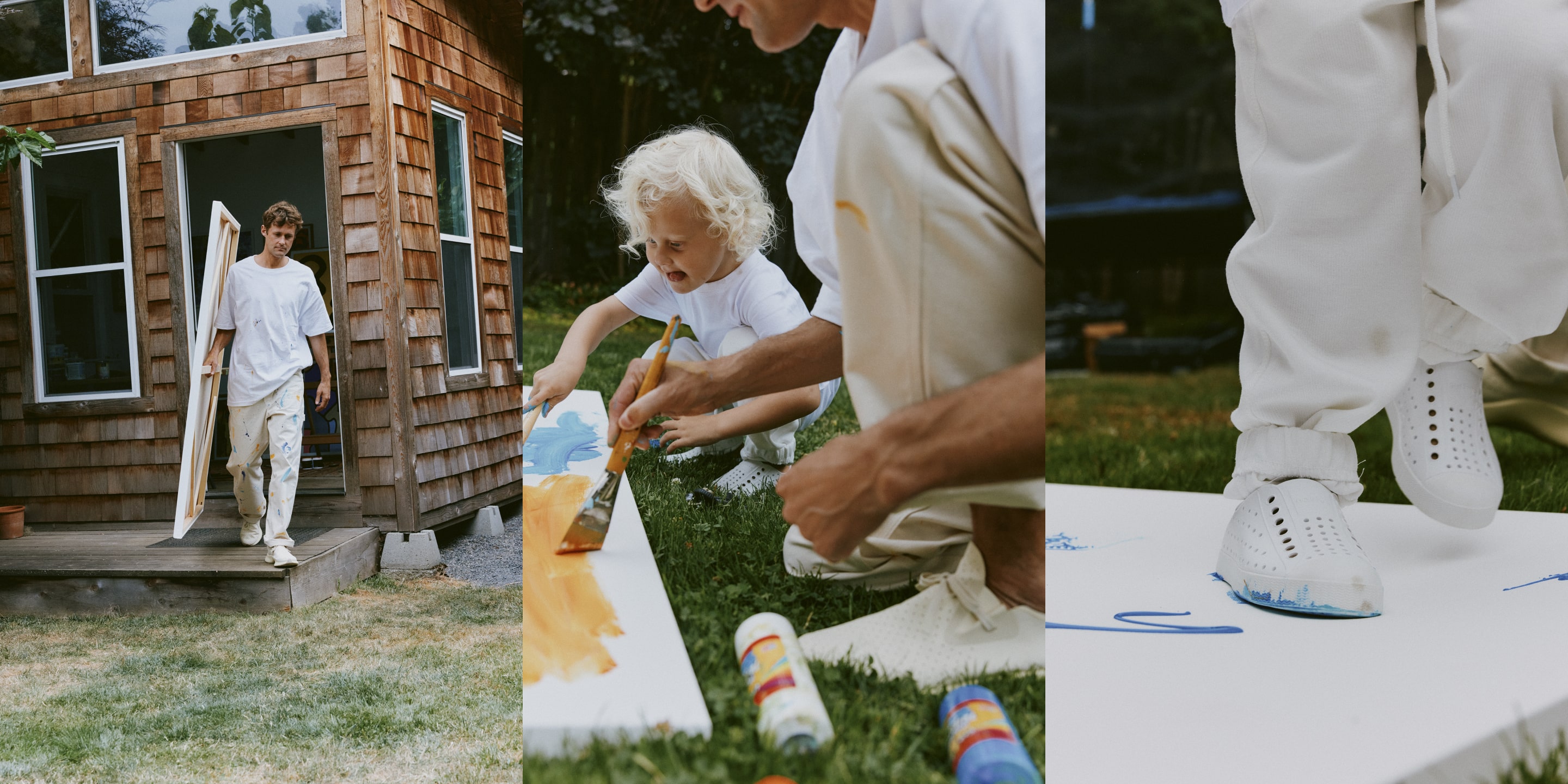 Sebo Walker outside his studio with a child and paintings