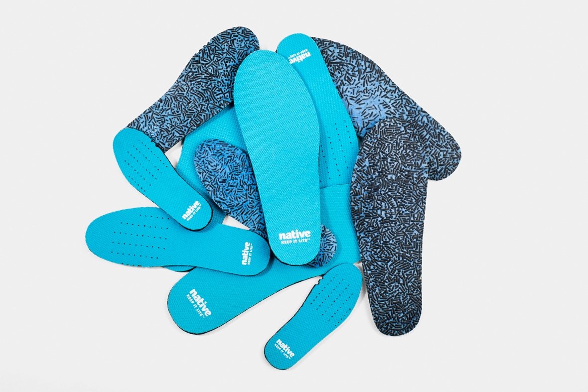 Pile of sneaker insoles made with sustainable recycled fibres